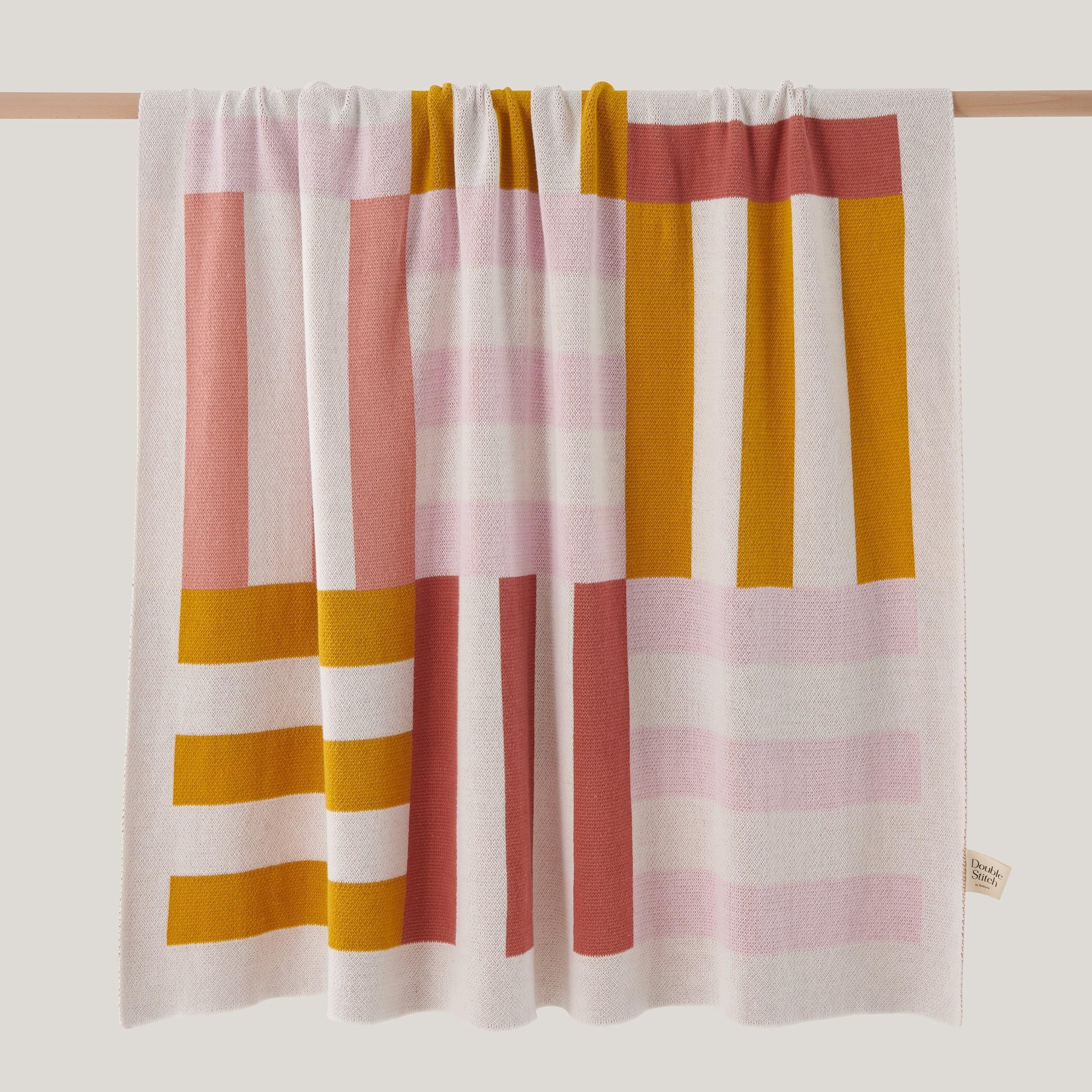 The cotton throw blanket with Intarsia knit design is a cozy and stylish addition to your home.