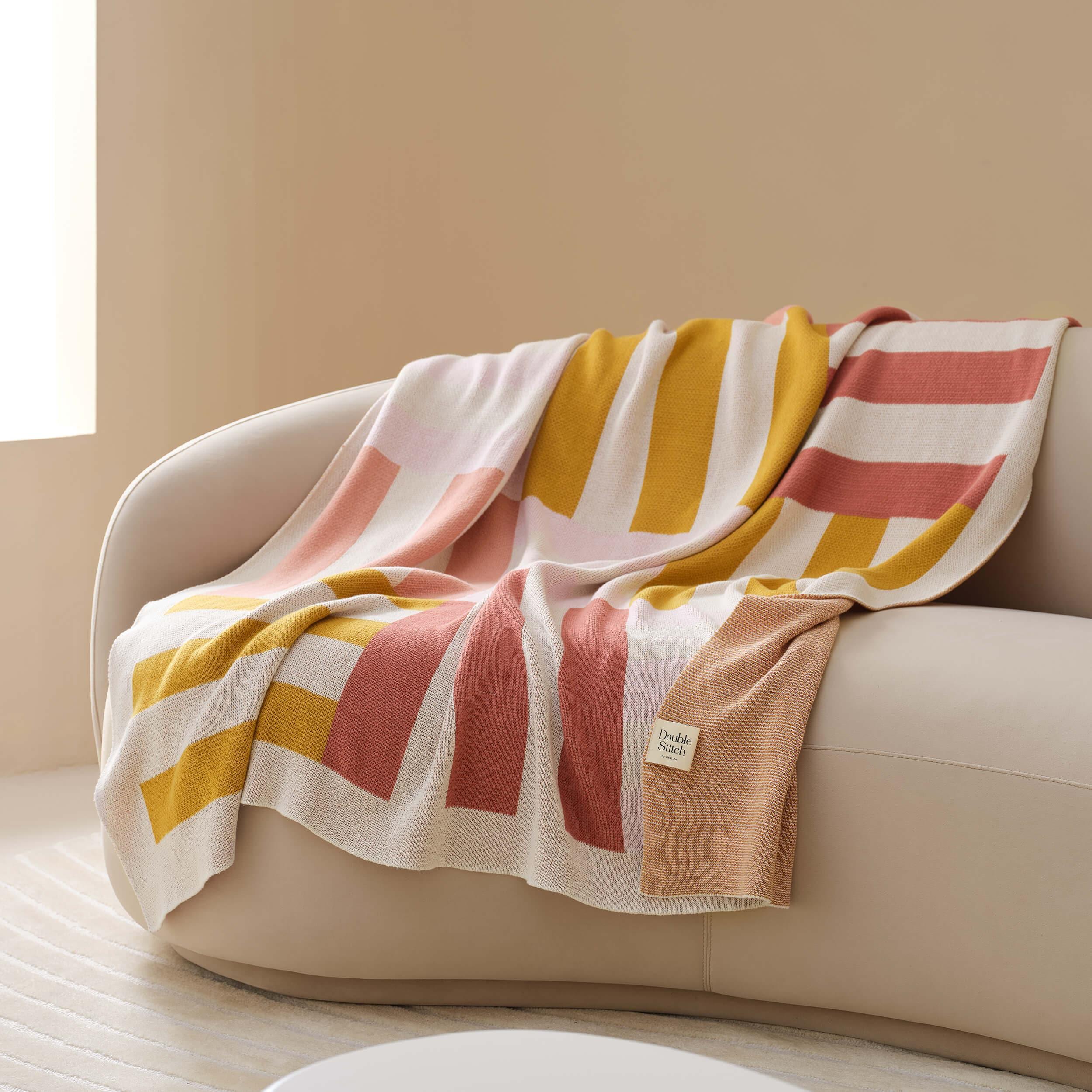 The versatile cotton throw blanket can be used as a decorative accent or for extra warmth during colder months.