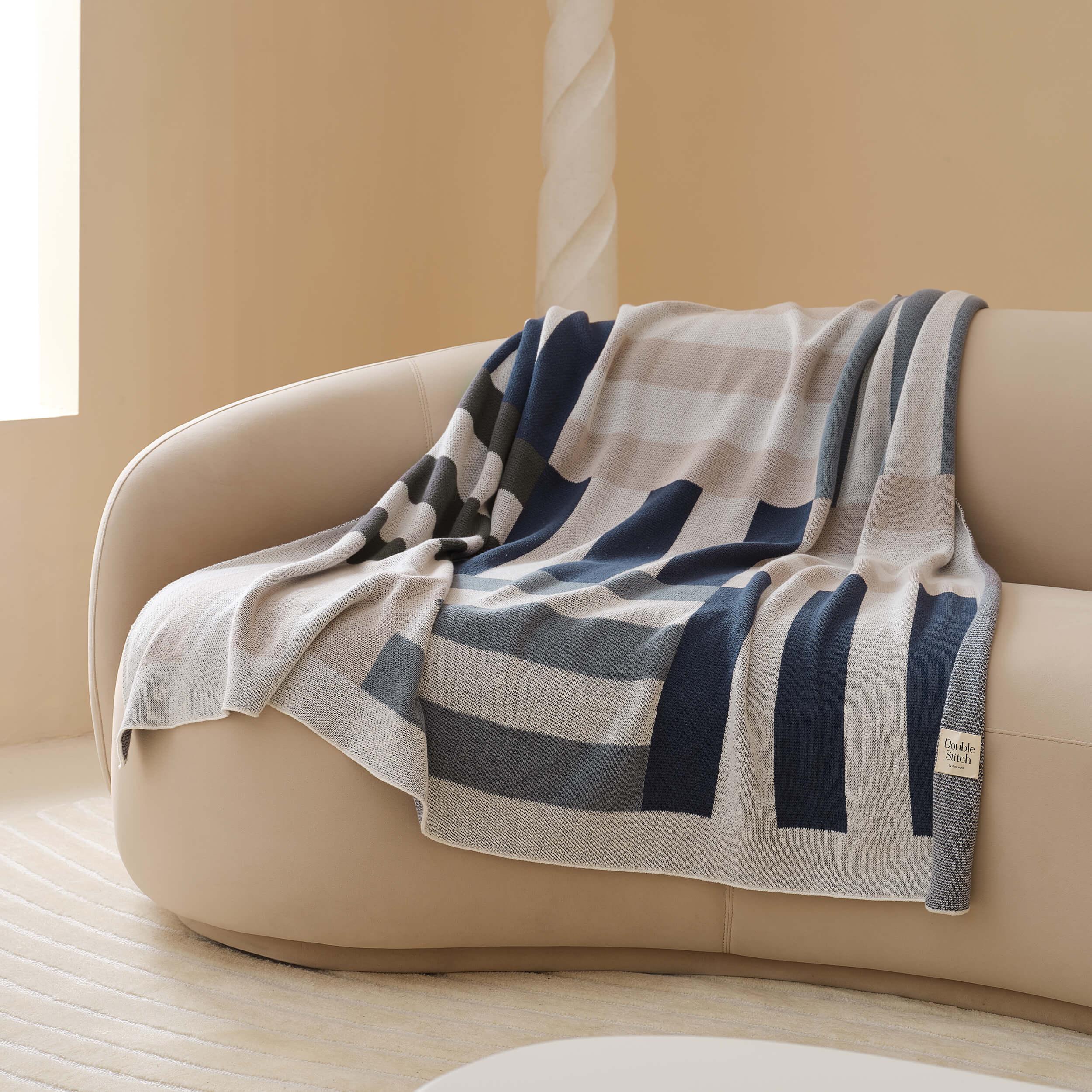 Elevate your home decor with the modern Intarsia knit throw blanket, a perfect blend of style and comfort.