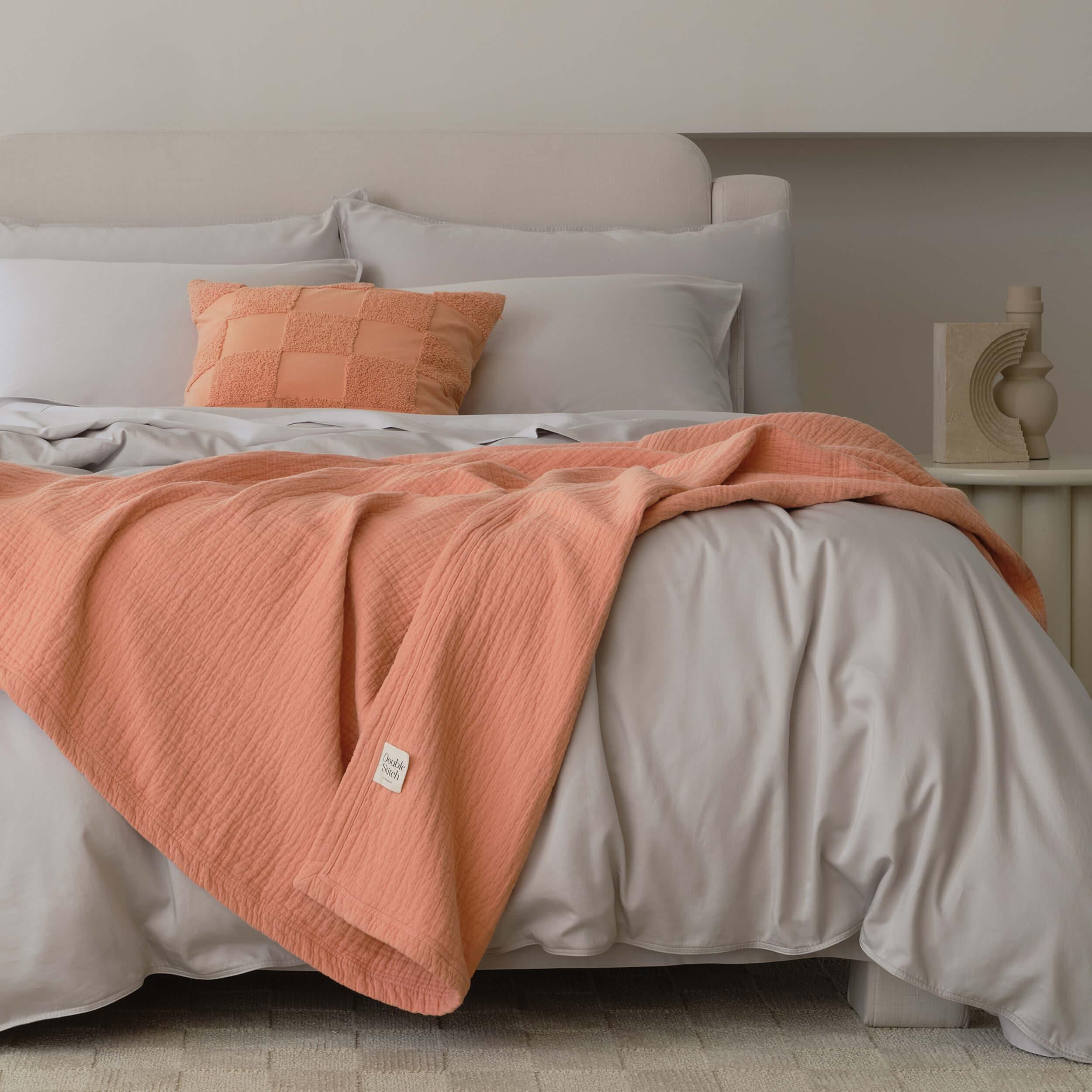 The modern throw blanket is a stylish accessory that can be draped over a chair or bed.