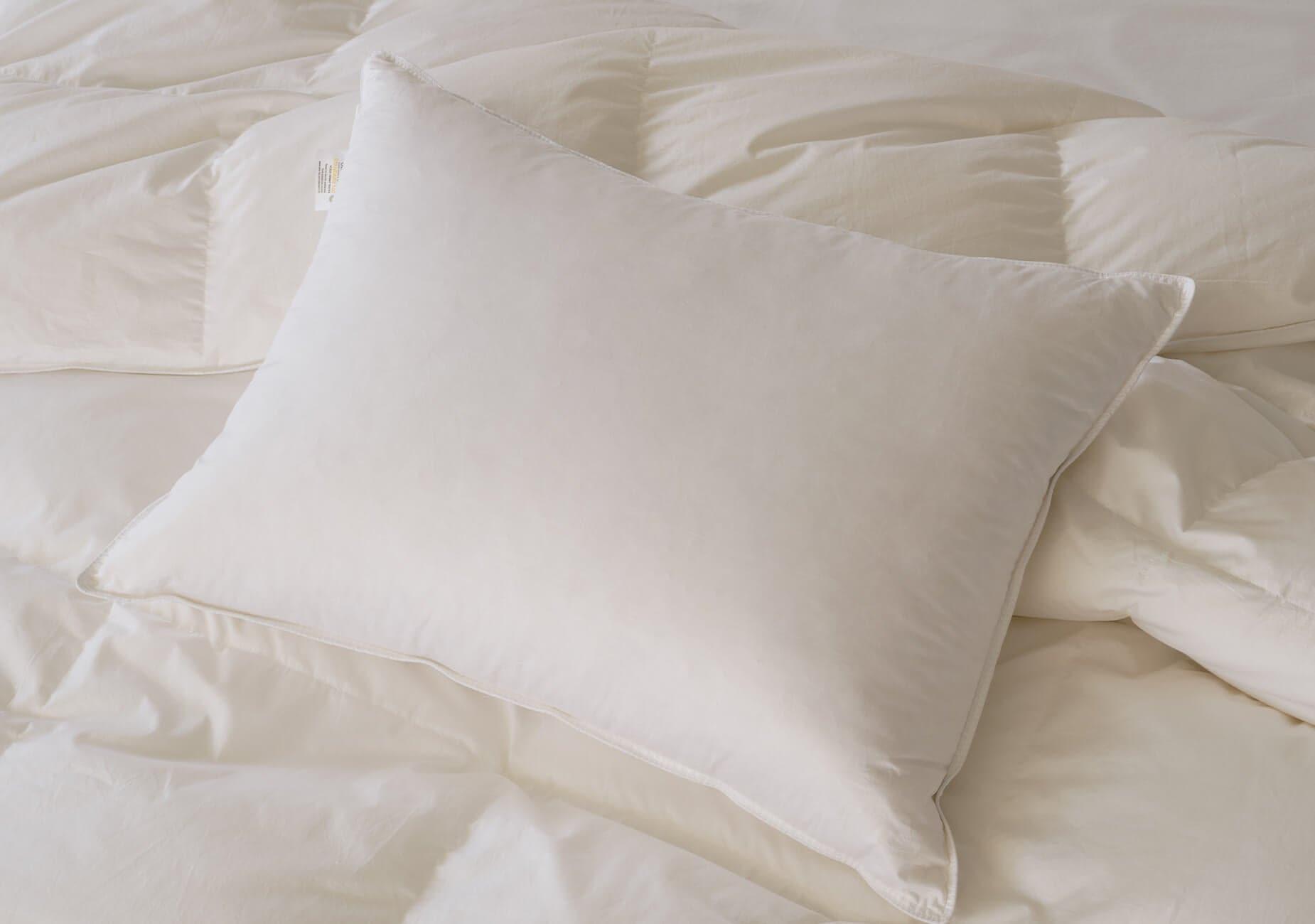 The white down pillow is a timeless and classic choice for a luxurious bedding experience.